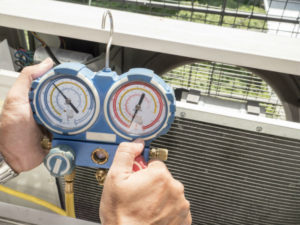 Technician providing heater repair service near Visalia, CA